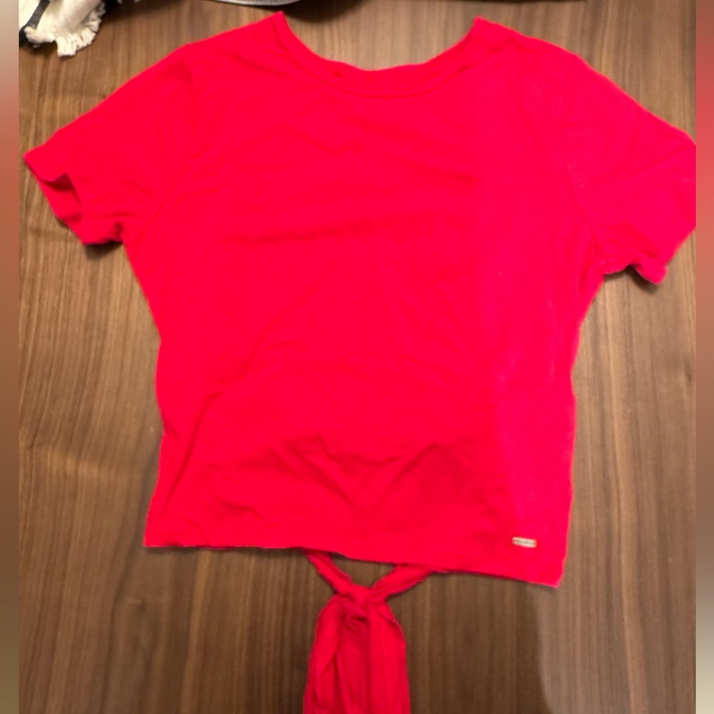 Cute red Hollister shirt with open lower back